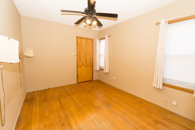 unfurnished room featuring ceiling fan and light hardwood / wood-style floors