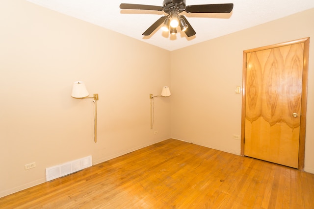 spare room with light hardwood / wood-style flooring and ceiling fan