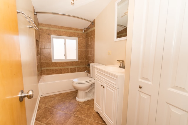 full bathroom featuring tile patterned flooring, vanity, toilet, and tiled shower / bath