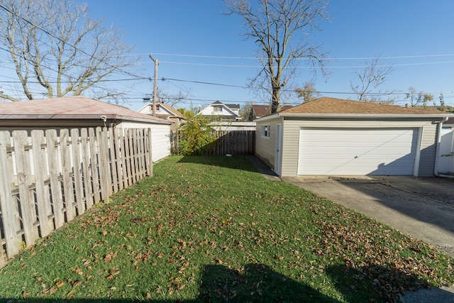 view of yard with a garage and an outdoor structure