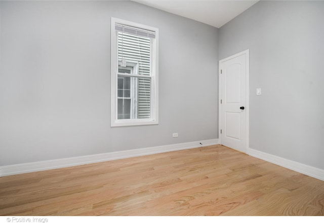 unfurnished room with light hardwood / wood-style floors