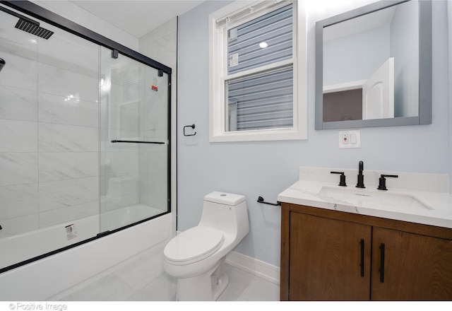 full bathroom featuring toilet, tile patterned floors, vanity, and enclosed tub / shower combo