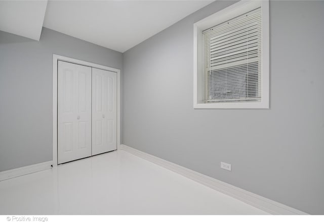 unfurnished bedroom featuring a closet