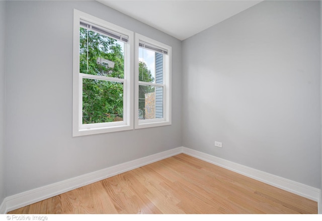 spare room featuring light hardwood / wood-style floors