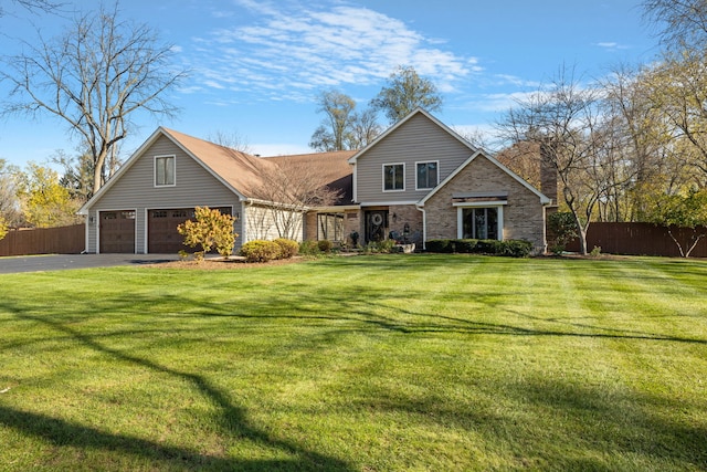 view of front facade featuring a front yard and a garage