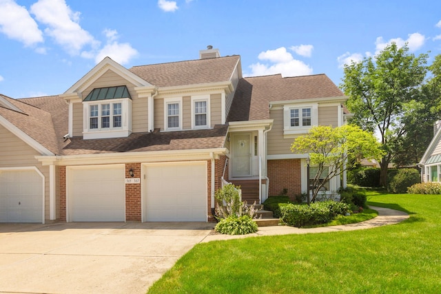 view of front of home featuring a garage and a front yard