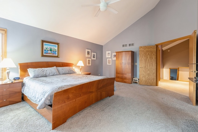 carpeted bedroom featuring ceiling fan and high vaulted ceiling