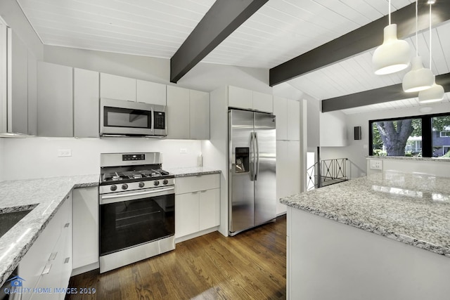 kitchen featuring white cabinetry, hanging light fixtures, appliances with stainless steel finishes, and dark wood-type flooring