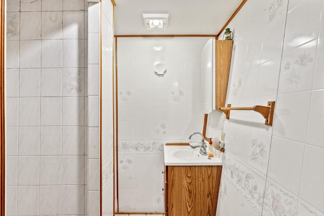 bathroom featuring vanity and a shower with door