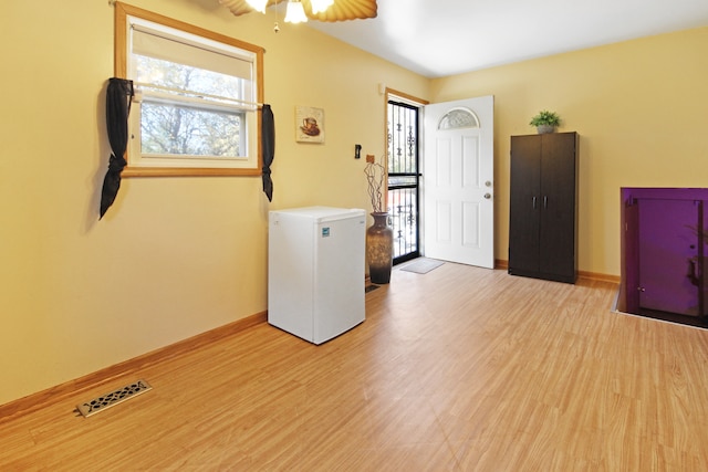 interior space featuring light hardwood / wood-style floors and ceiling fan