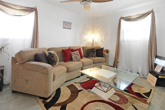 living room featuring carpet floors and ceiling fan