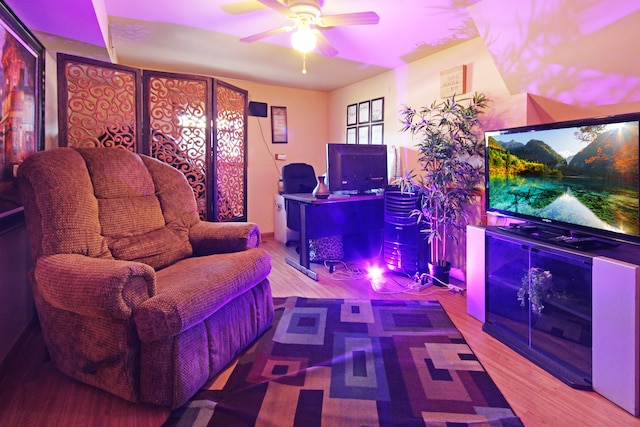 living room featuring hardwood / wood-style flooring and ceiling fan