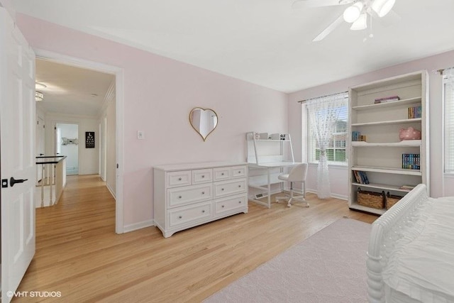 bedroom with light wood-type flooring and ceiling fan