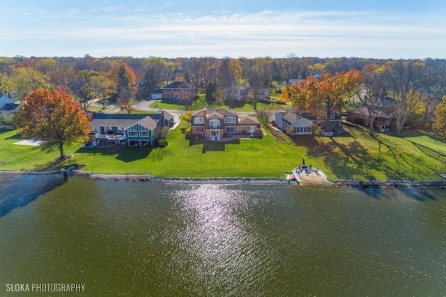 bird's eye view with a water view