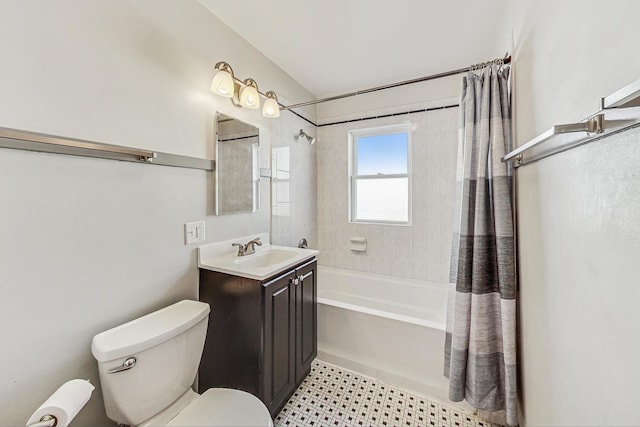 full bathroom with vanity, shower / tub combo with curtain, and toilet