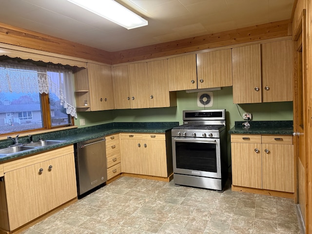 kitchen featuring light brown cabinetry, sink, and appliances with stainless steel finishes