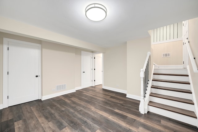 basement featuring dark hardwood / wood-style floors