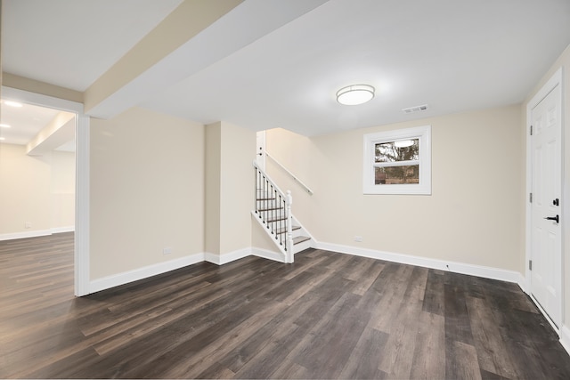 basement featuring dark hardwood / wood-style floors