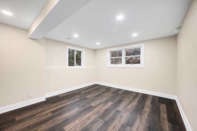 basement featuring dark hardwood / wood-style floors