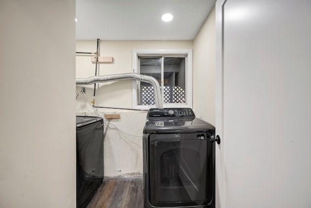 washroom featuring washer / clothes dryer and dark wood-type flooring