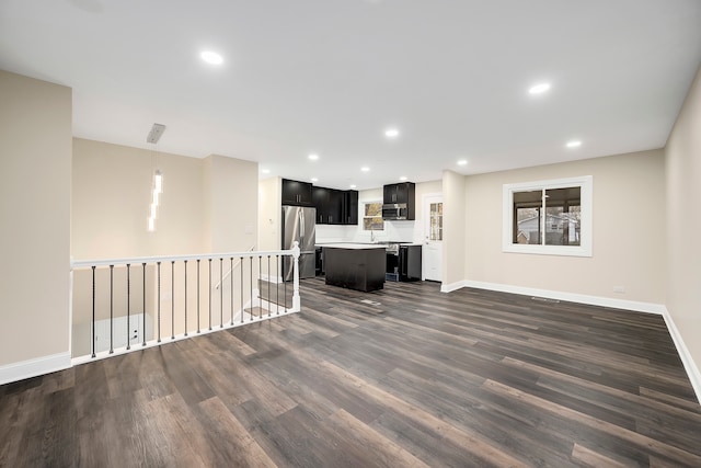 unfurnished living room featuring dark hardwood / wood-style floors