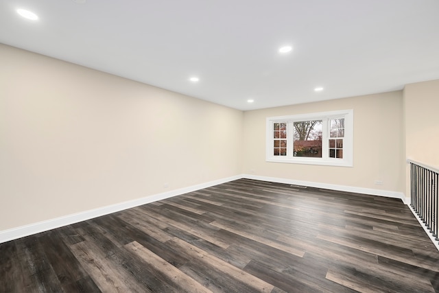 unfurnished room featuring dark hardwood / wood-style flooring