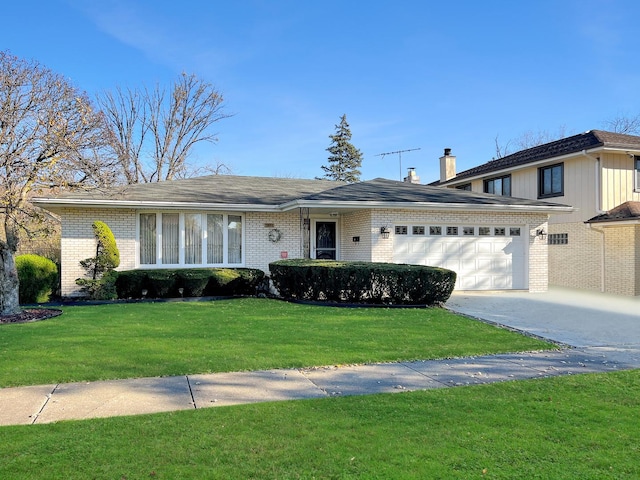 ranch-style home with a front yard and a garage