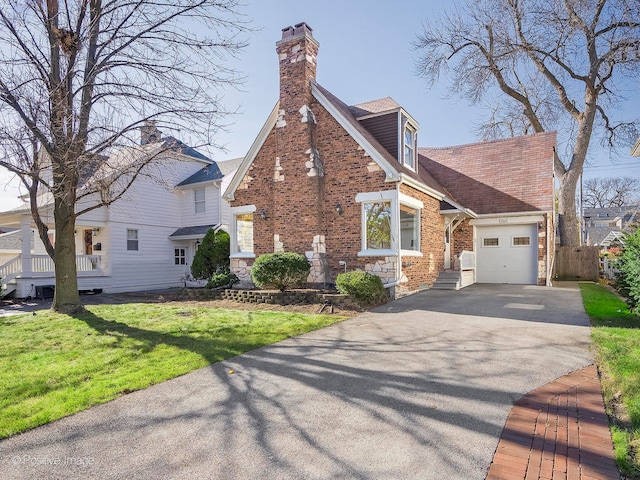 view of home's exterior with a garage and a yard