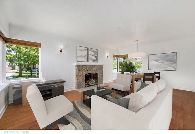 living room with a fireplace and light hardwood / wood-style floors