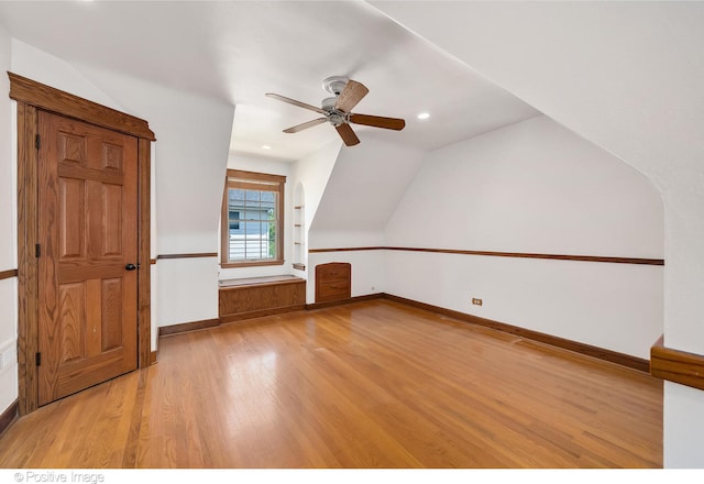 additional living space featuring ceiling fan, light wood-type flooring, and lofted ceiling