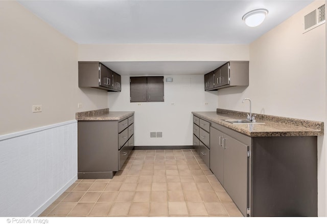 kitchen with sink and gray cabinetry