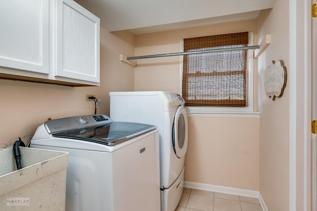 1019 N Webster St, Naperville, IL 60563 - laundry area with independent washer and dryer, cabinet space, light tile patterned floors, and baseboards