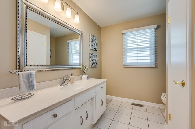 1019 N Webster St, Naperville, IL 60563 - bathroom featuring vanity, tile patterned flooring, baseboards, and toilet