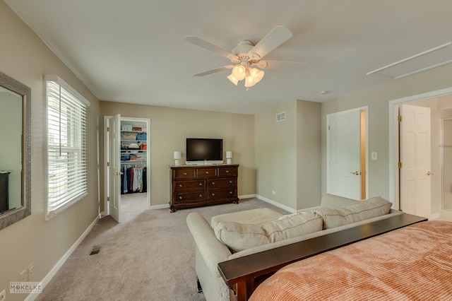 1019 N Webster St, Naperville, IL 60563 - bedroom with a spacious closet, light colored carpet, a closet, baseboards, and ceiling fan