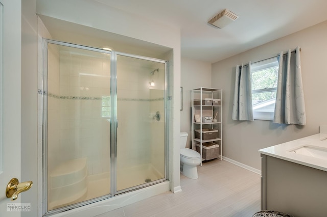 1019 N Webster St, Naperville, IL 60563 - bathroom featuring baseboards, toilet, a stall shower, and vanity