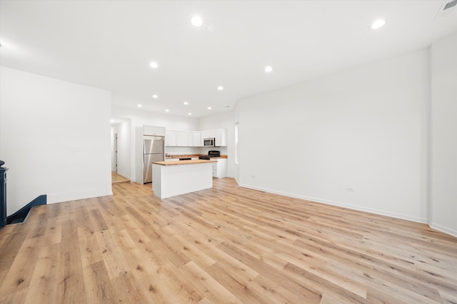 unfurnished living room featuring light hardwood / wood-style flooring