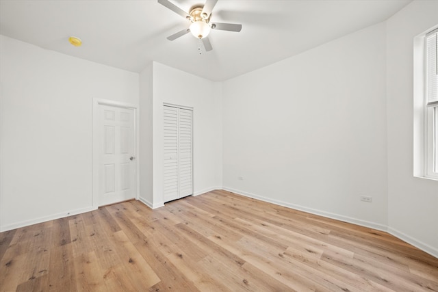 unfurnished bedroom featuring light wood-type flooring and ceiling fan