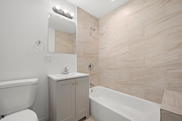 full bathroom featuring vanity, tiled shower / bath combo, and toilet