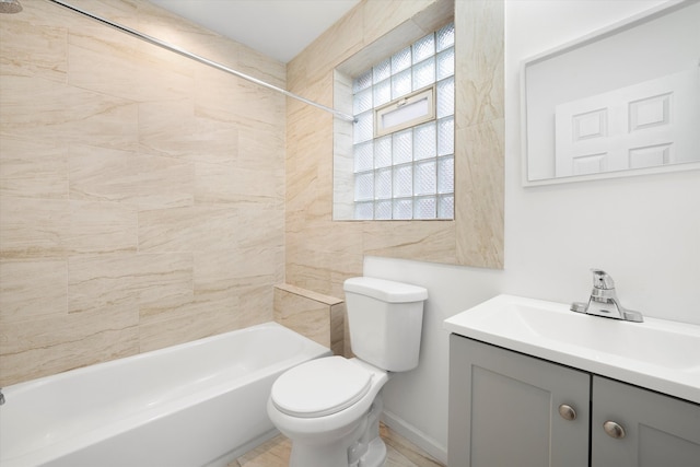 full bathroom featuring vanity, toilet, and tiled shower / bath