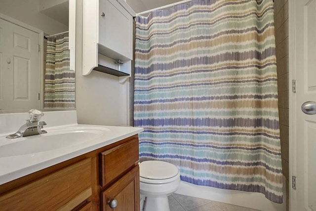 bathroom featuring tile patterned flooring, vanity, a shower with curtain, and toilet