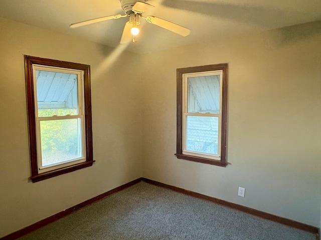 carpeted empty room with ceiling fan