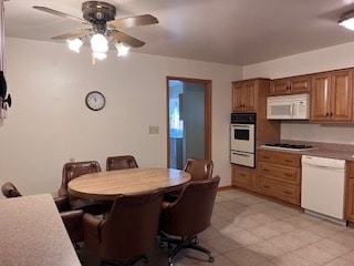 kitchen with white appliances and ceiling fan