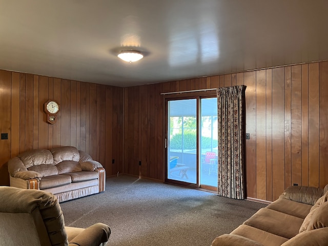 living room featuring wooden walls and carpet floors