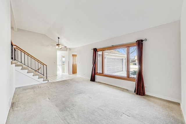 unfurnished living room with ceiling fan, vaulted ceiling, and light carpet