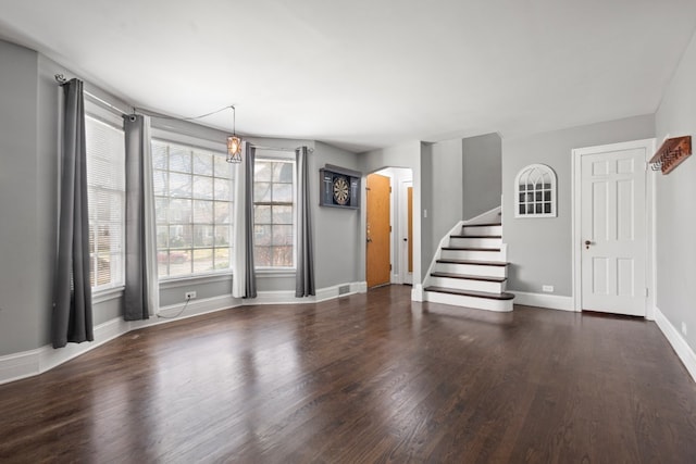 unfurnished room featuring dark wood-type flooring