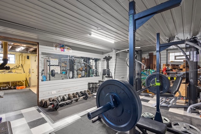 exercise room featuring wooden walls