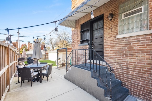 view of patio / terrace featuring an outbuilding