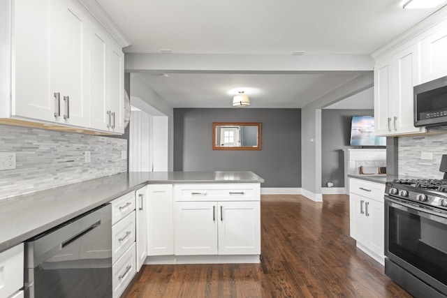 kitchen featuring kitchen peninsula, stainless steel appliances, white cabinetry, and dark wood-type flooring