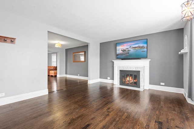 unfurnished living room featuring hardwood / wood-style flooring