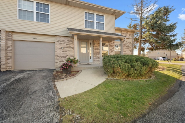 view of front of property featuring a porch and a garage